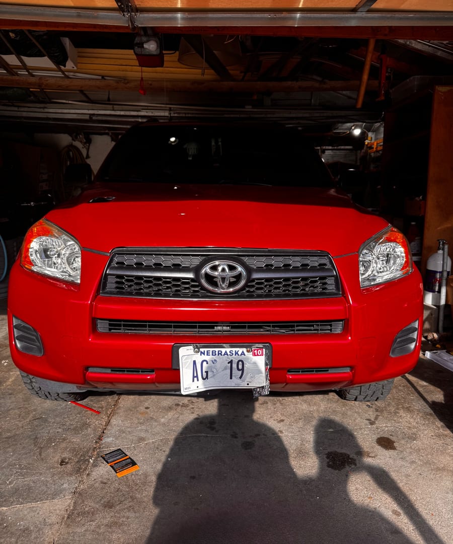 The same RAV4 finished by A & A Mobile Detailing, deep red gloss and clear headlights